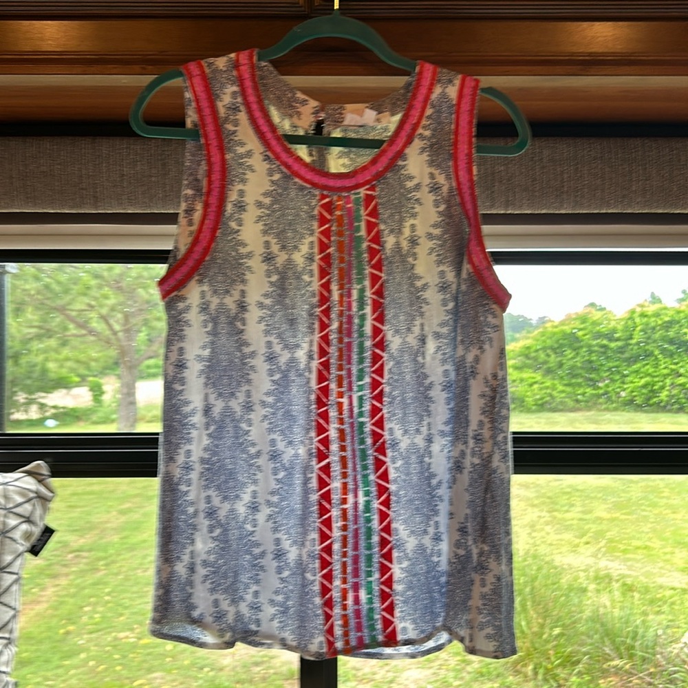 NWOT(never worn) women’s sleeveless blouse by THML size Large 100 percent rayon